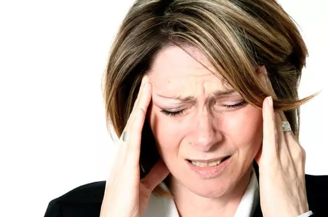 Woman Suffering from TMJ Headaches