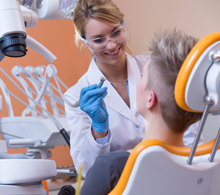 dentist performing a root canal treatment