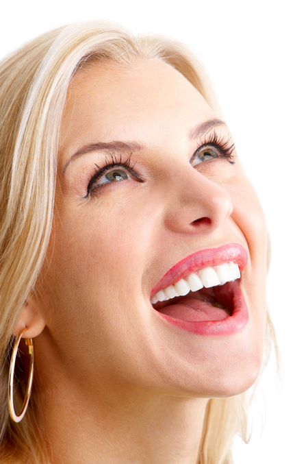 woman smiling after teeth whitening procedure